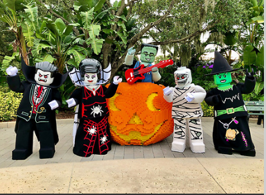 LEGOLAND Halloween characters around a large pumpkin- our favorite places for Halloween